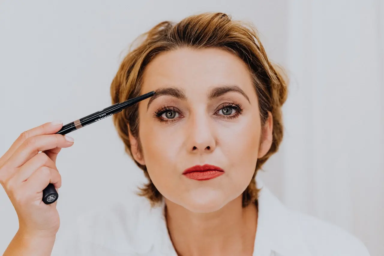 Eyebrow pencil defining a brow shape